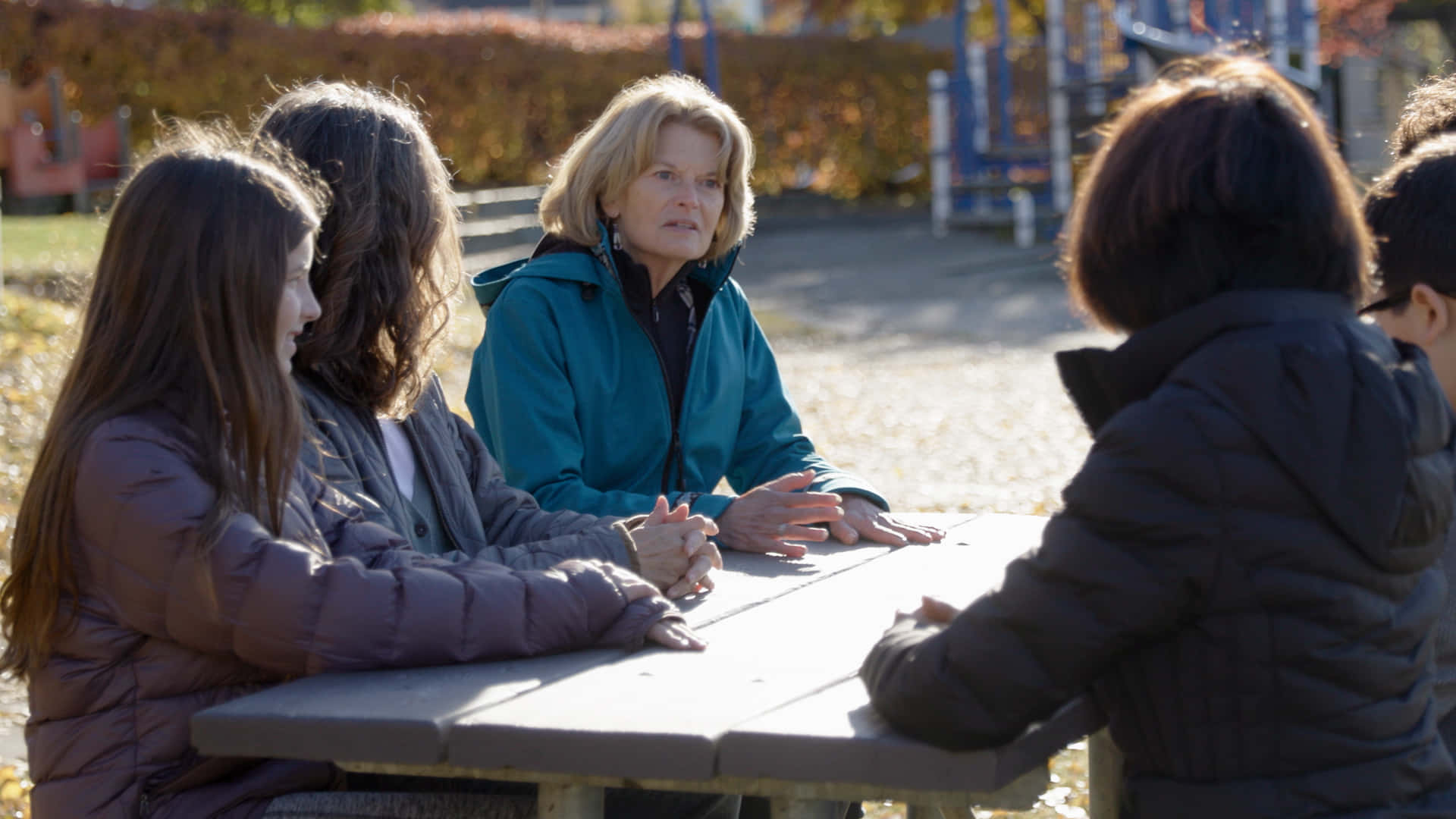 Lisa Murkowski Speaking At Playground Background