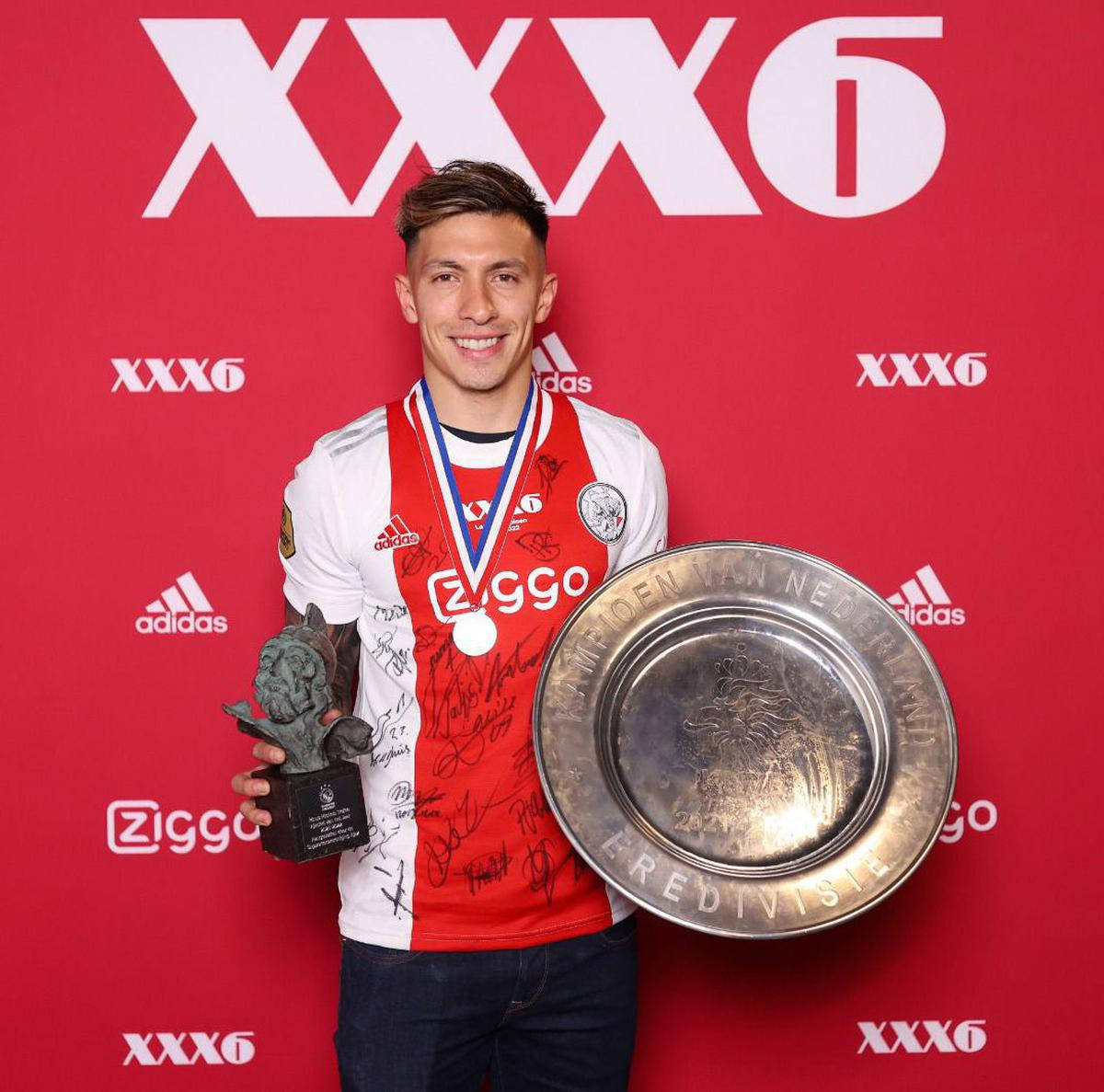 Lisandro Martínez, Beaming With Pride, Holds His Medal And Trophy