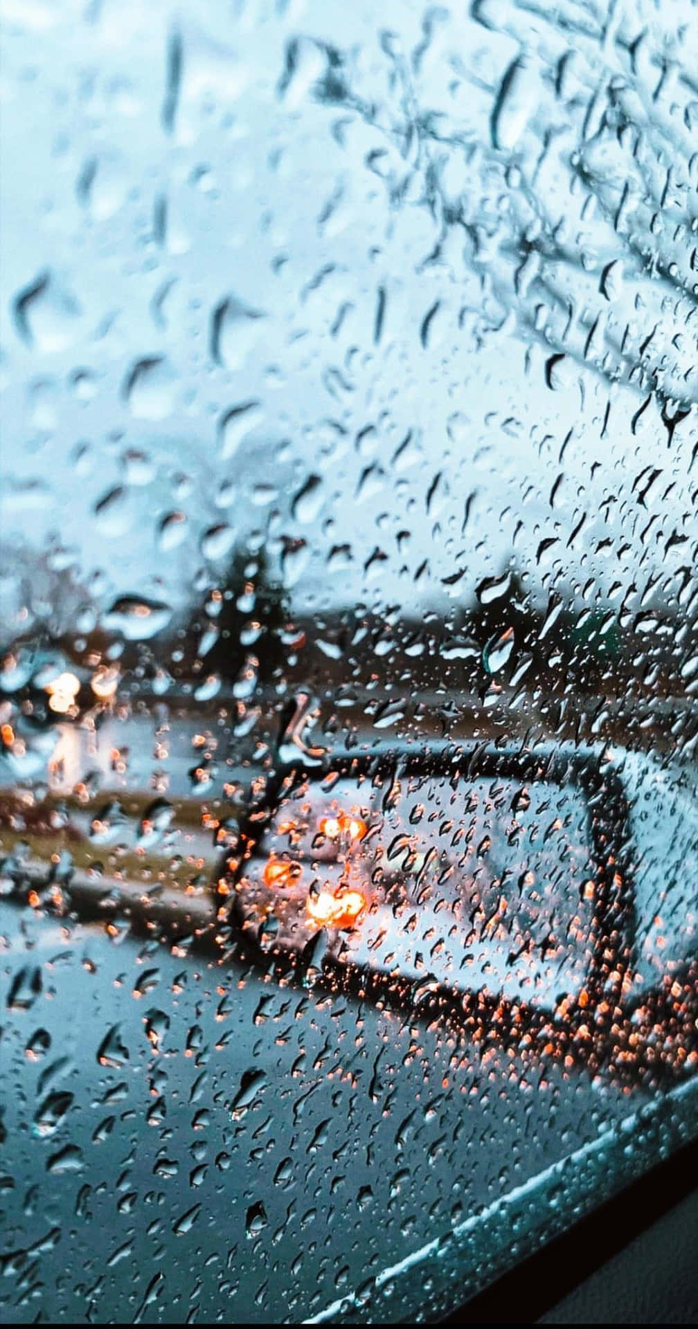 Listen To The Sound Of The Rain Amidst A Vibrant Cityscape Background