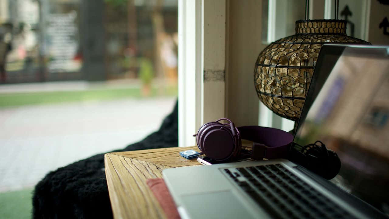 Listening To Music With A Laptop Background