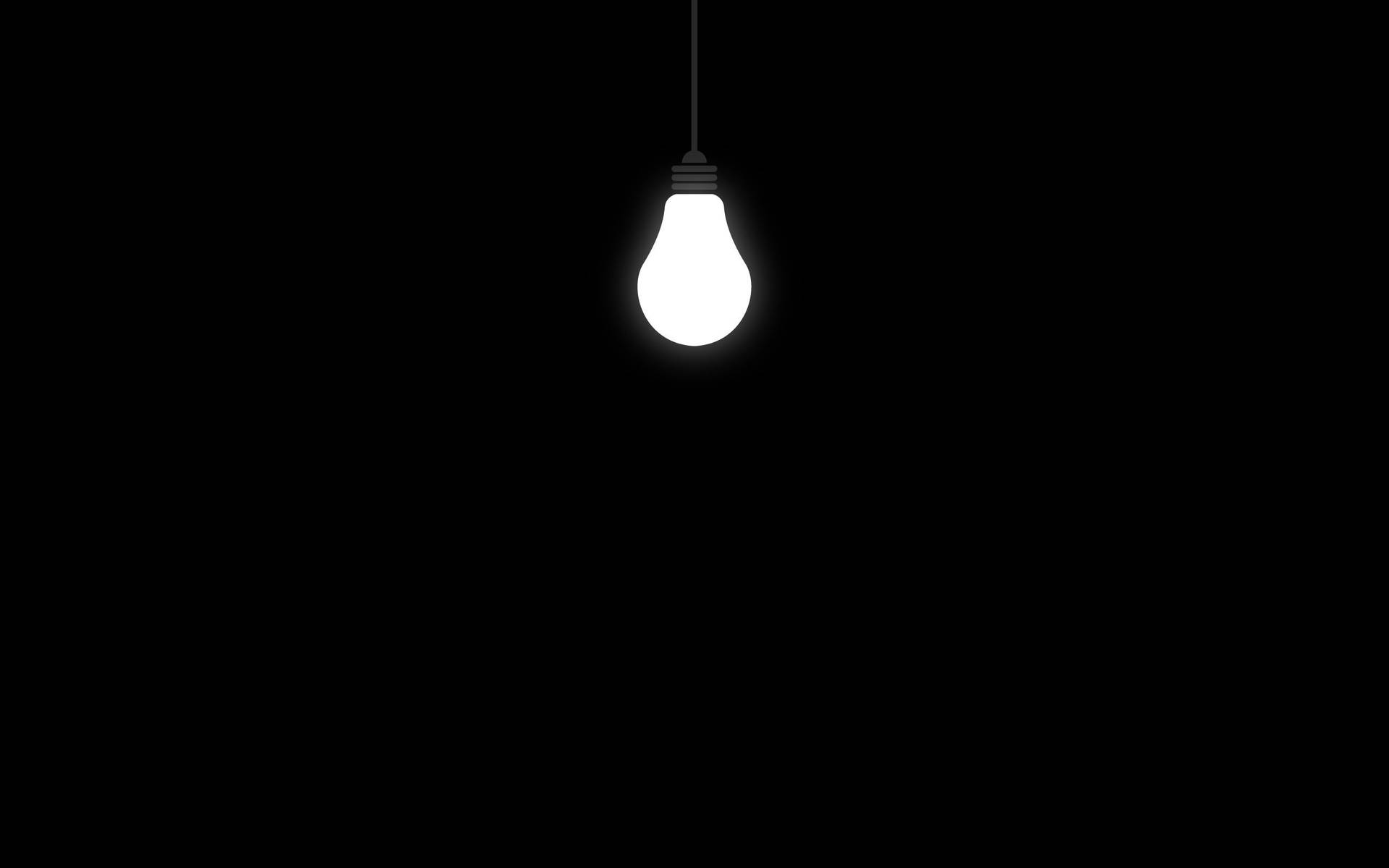 Lit Up Bulb On Black Pc Background