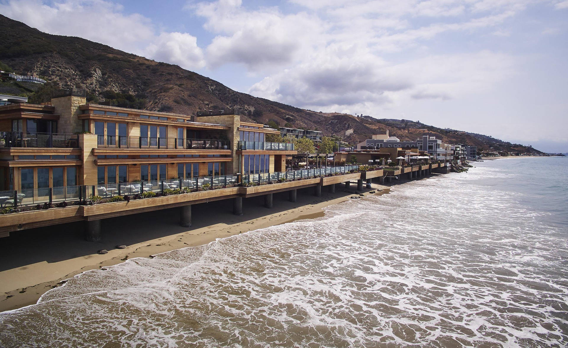 Little Beach House On Malibu Beach Background