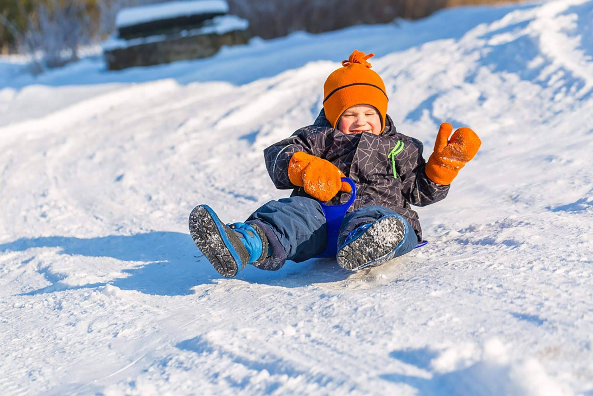 Little Boy Sledding Slide Background