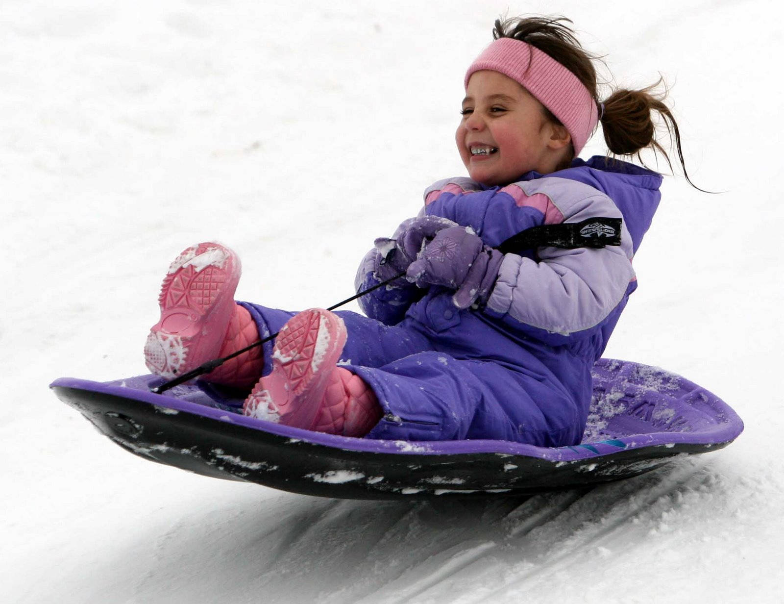 Little Girl Happy Sledding