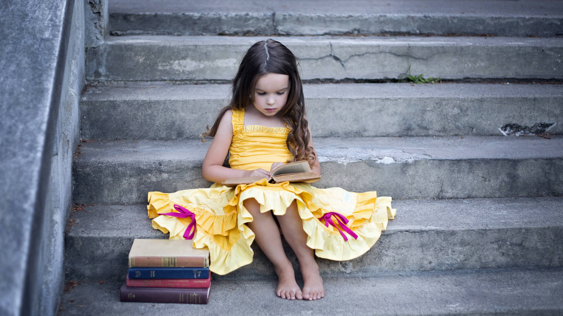 Little Girl Reading Book At Stairs Background