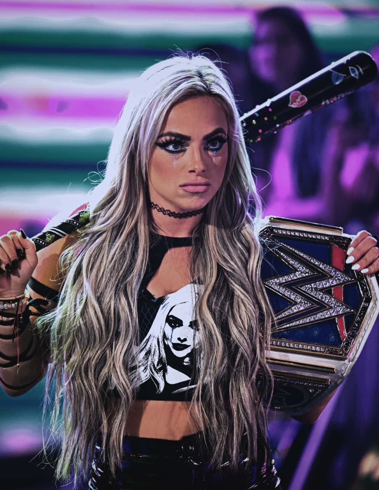 Liv Morgan Holding Wwe Belt Black Bat Background