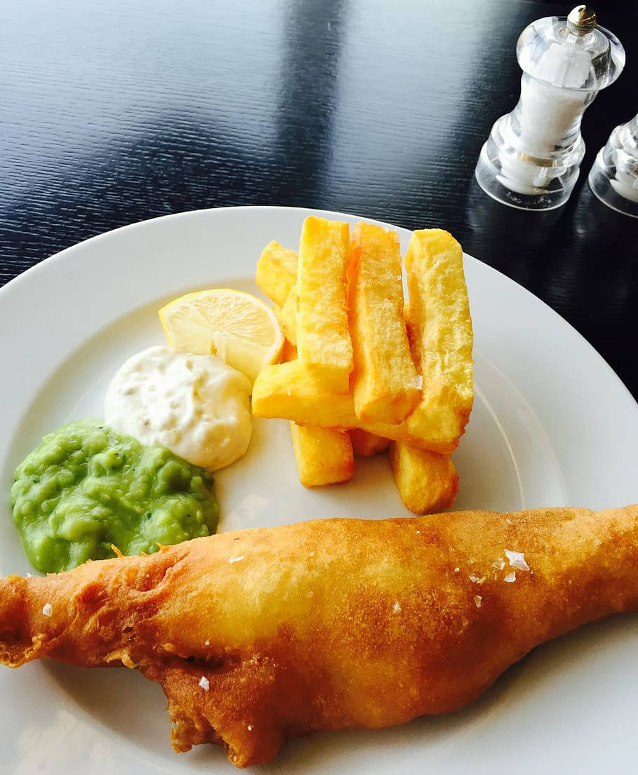 Lively Table With A Plate Of Fish And Chips