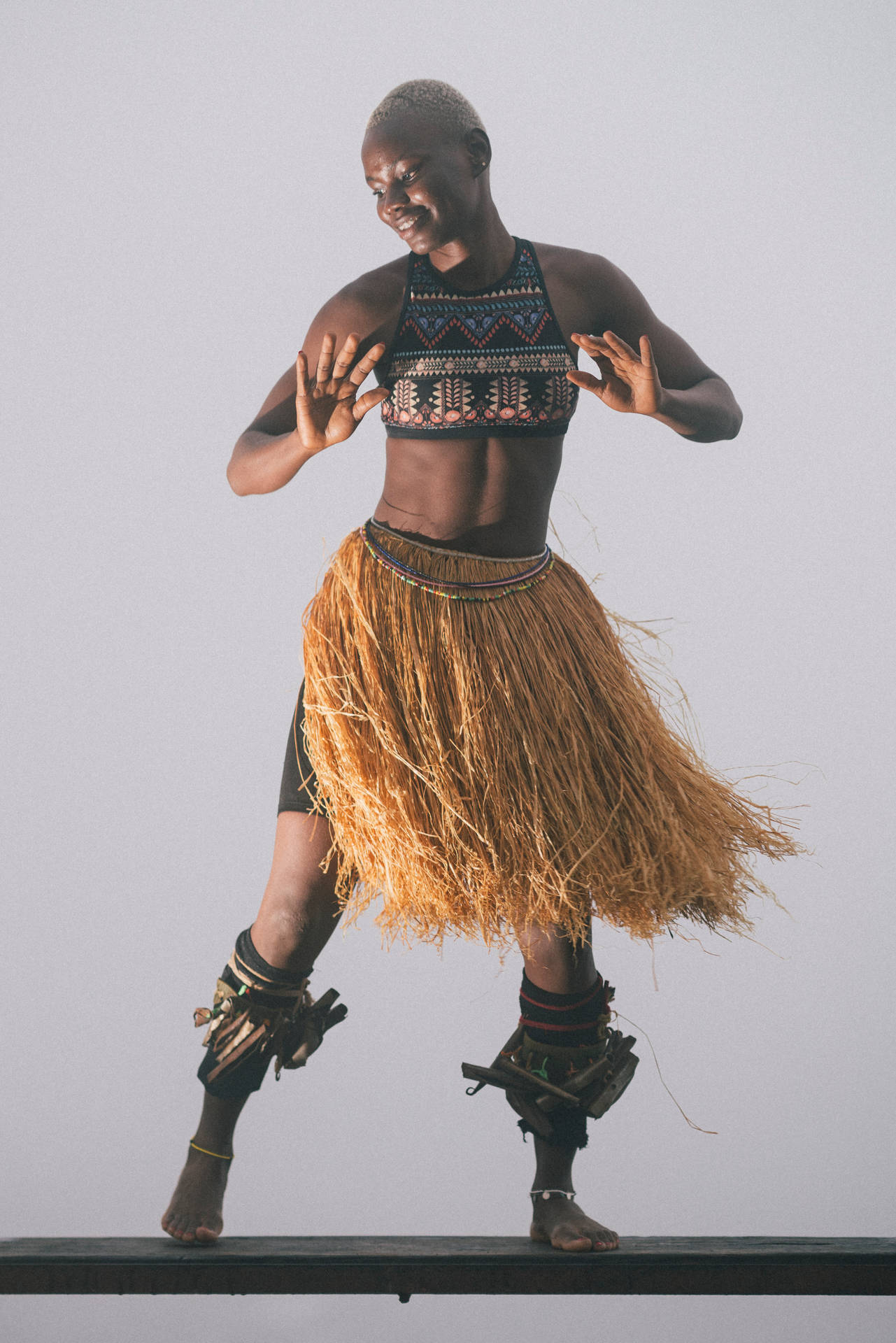 Lively Woman Dancing In Sierra Leone Background