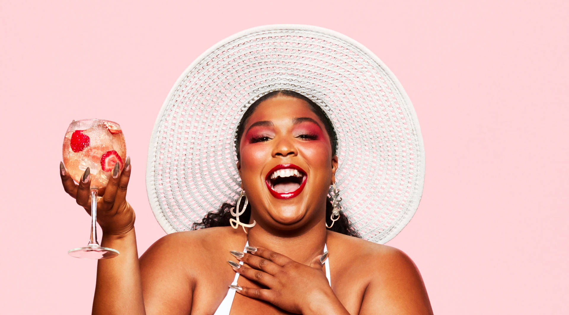 Lizzo Shines In Absolut Juice Music Video Background