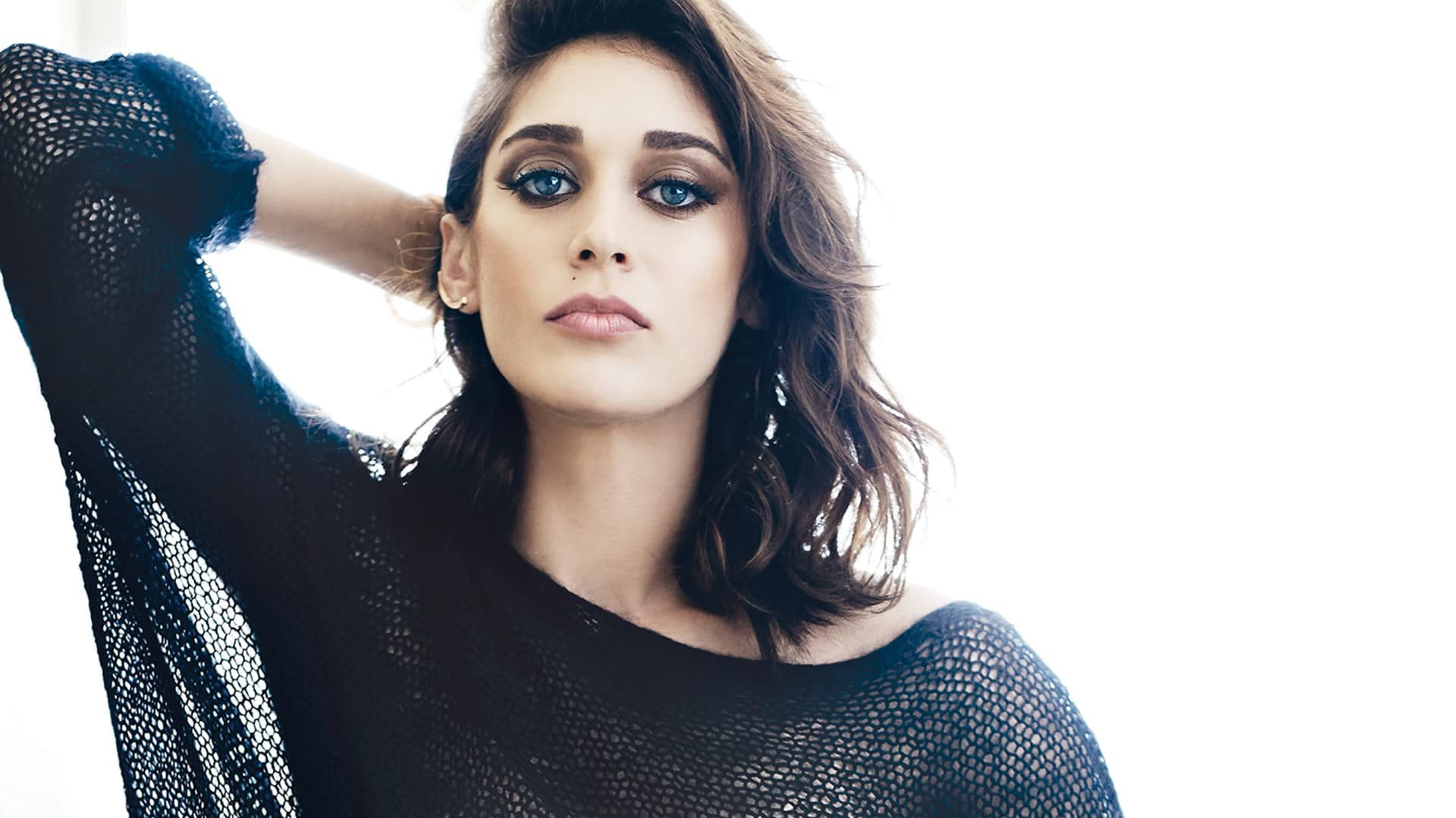 Lizzy Caplan In A Black Net Design Top Background