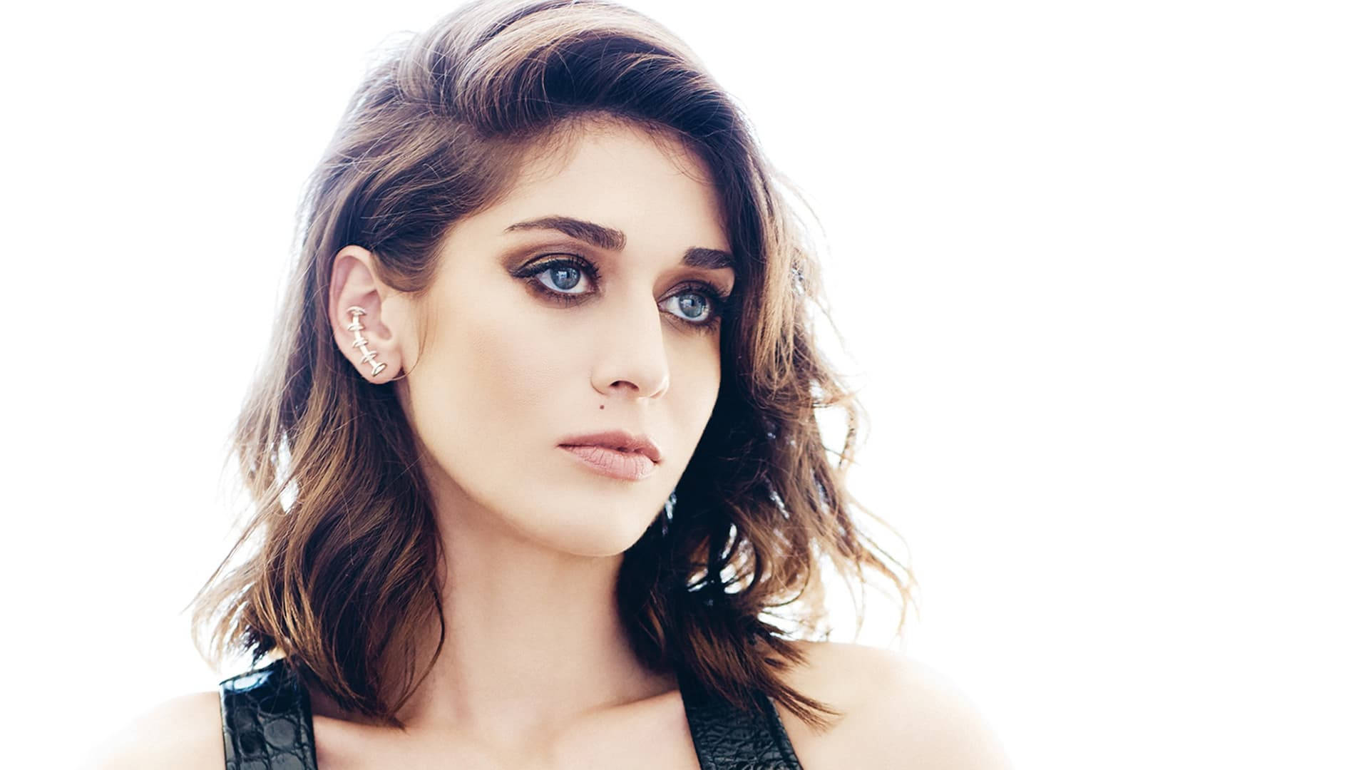 Lizzy Caplan In A Black Sleeveless Top Background