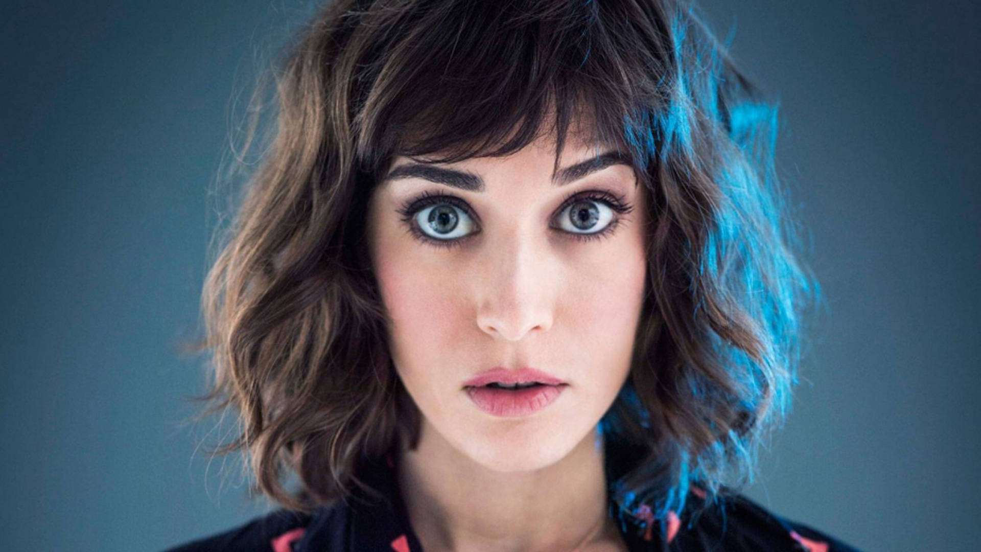 Lizzy Caplan With A Wide-eyed Look Background