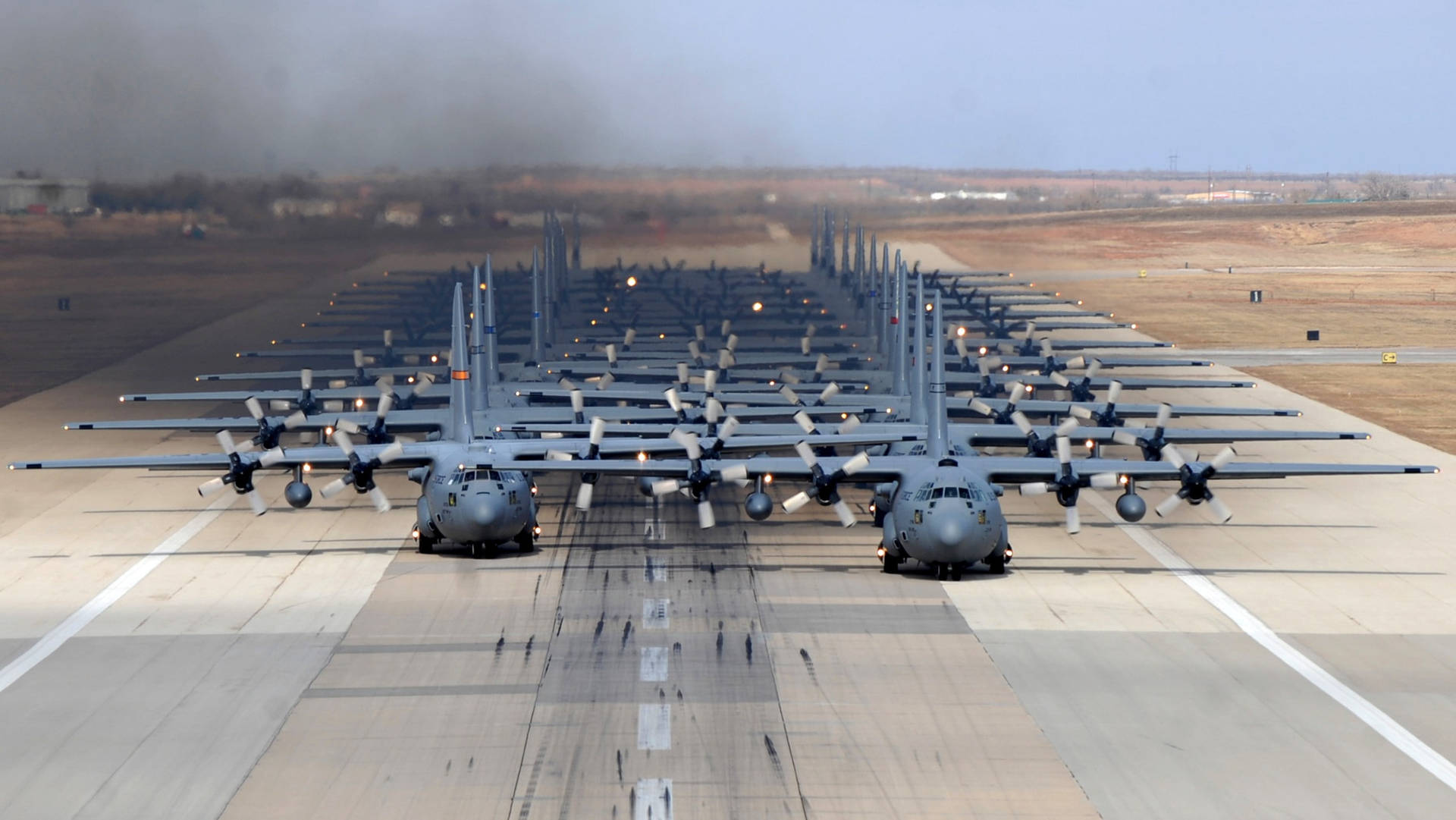 Lockheed C-130s On Runway Background