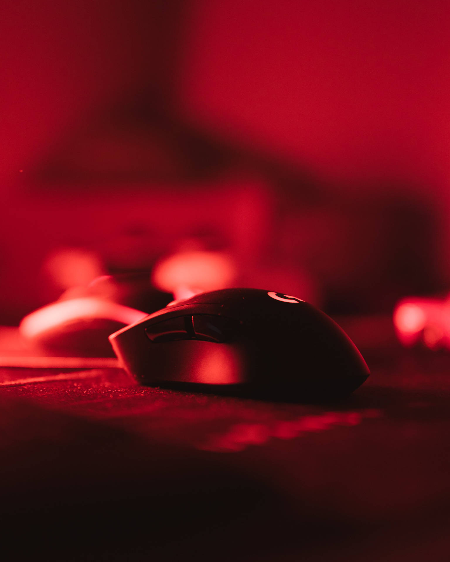 Logitech Mouse On Red Light Background