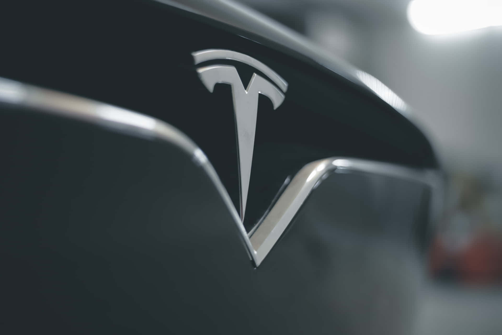 Logo Of The Technological Automobile Company Tesla In 4k Resolution Background