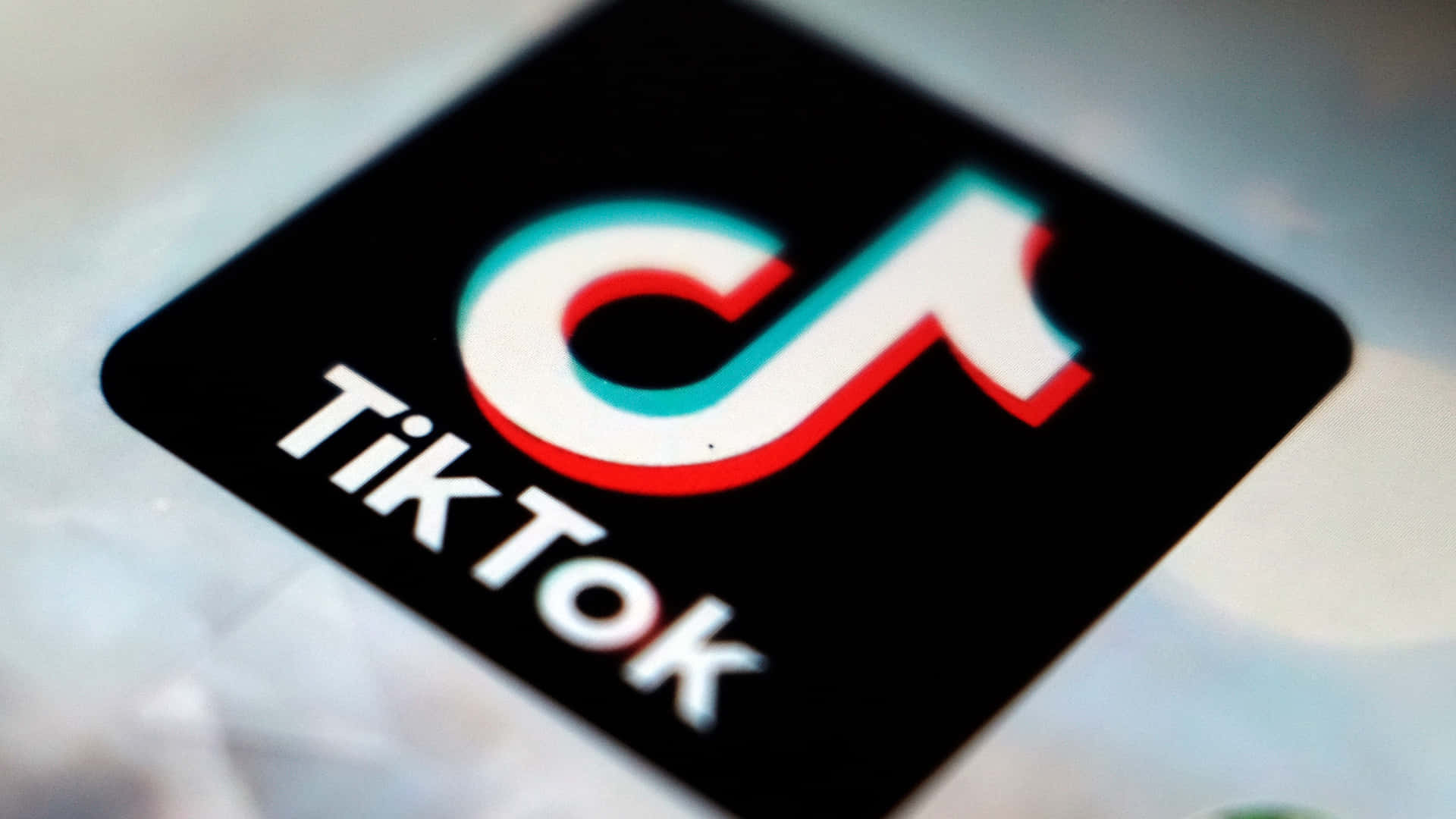 Logo Of Tiktok, The Popular Social Media Platform Background