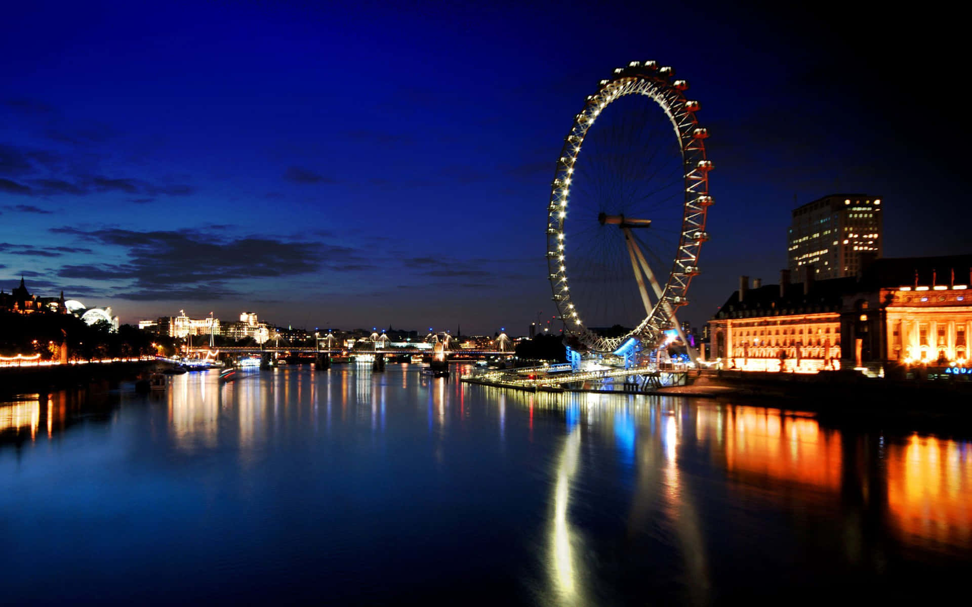London Eye At Night With City Lights Background