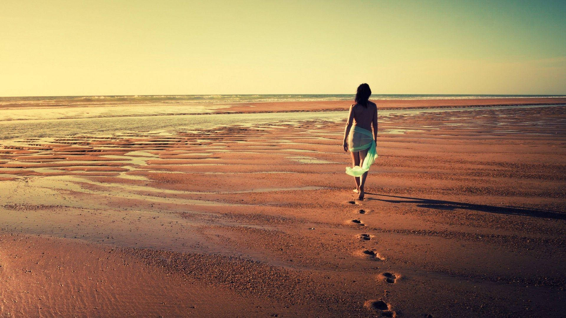 Lone Girl Embracing Solitude In The Vast Wilderness Background