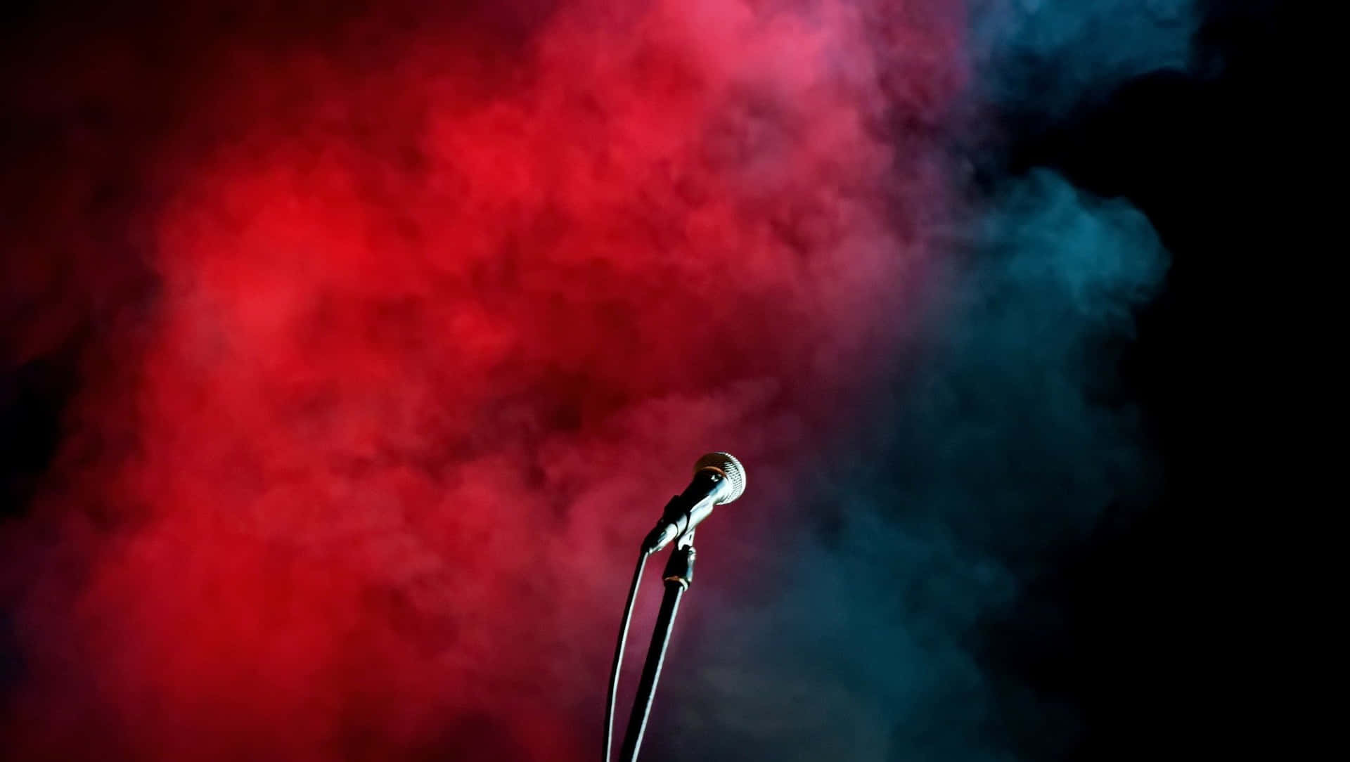 Lone Microphone In Red And Blue Smoke Background