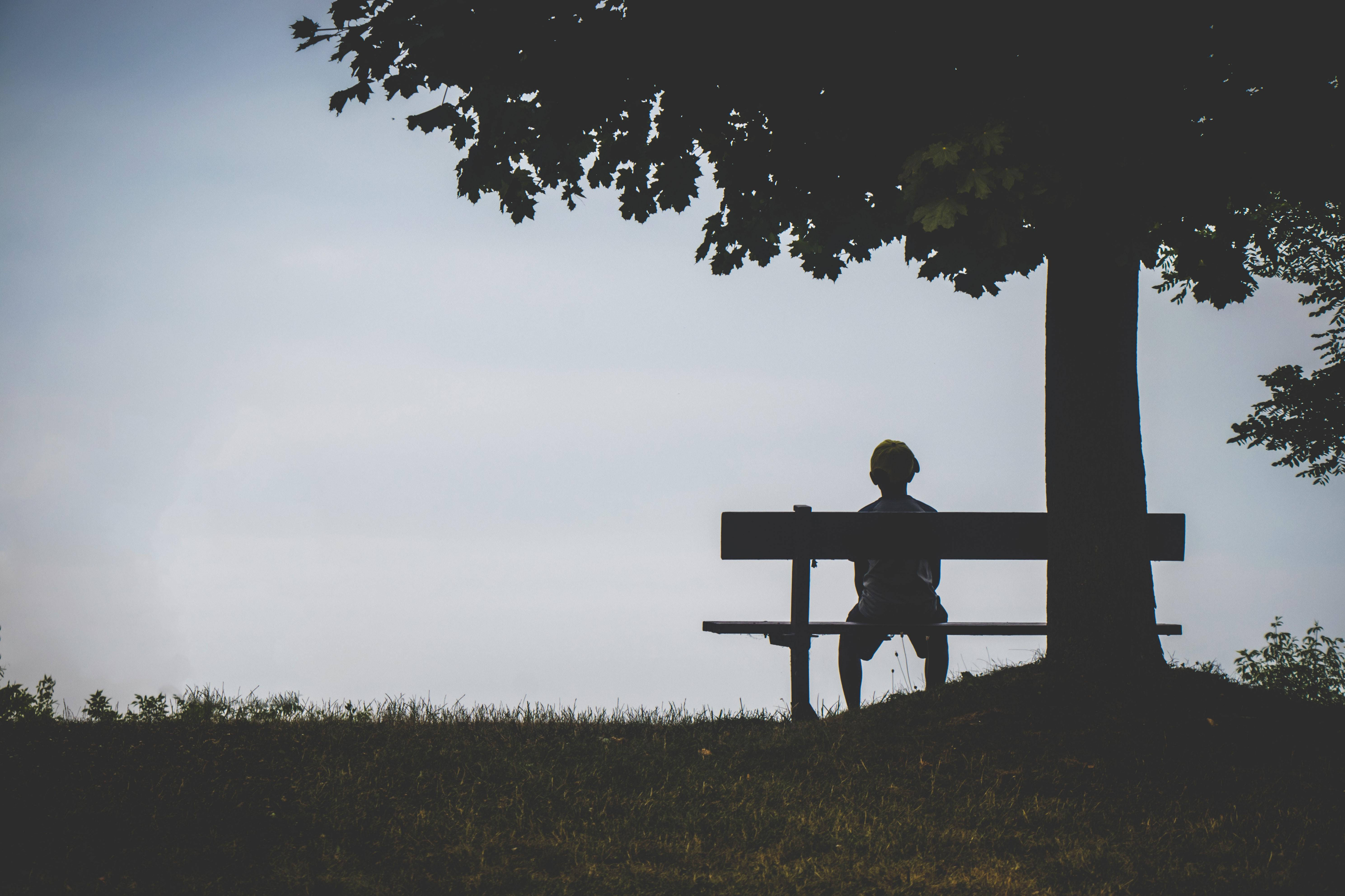 Lonely Boy On Bench With Phone Background