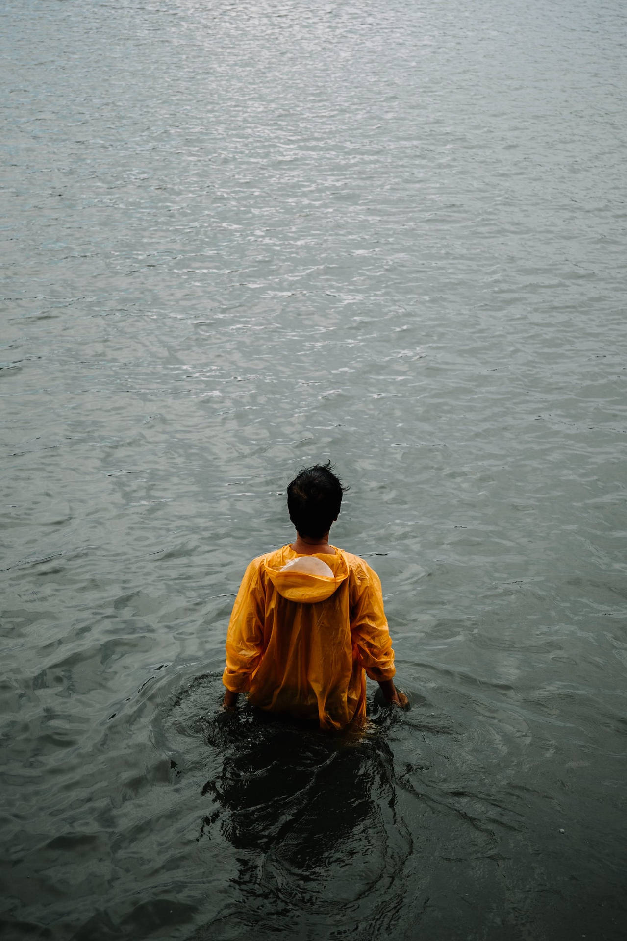 Lonely Man In Water Background