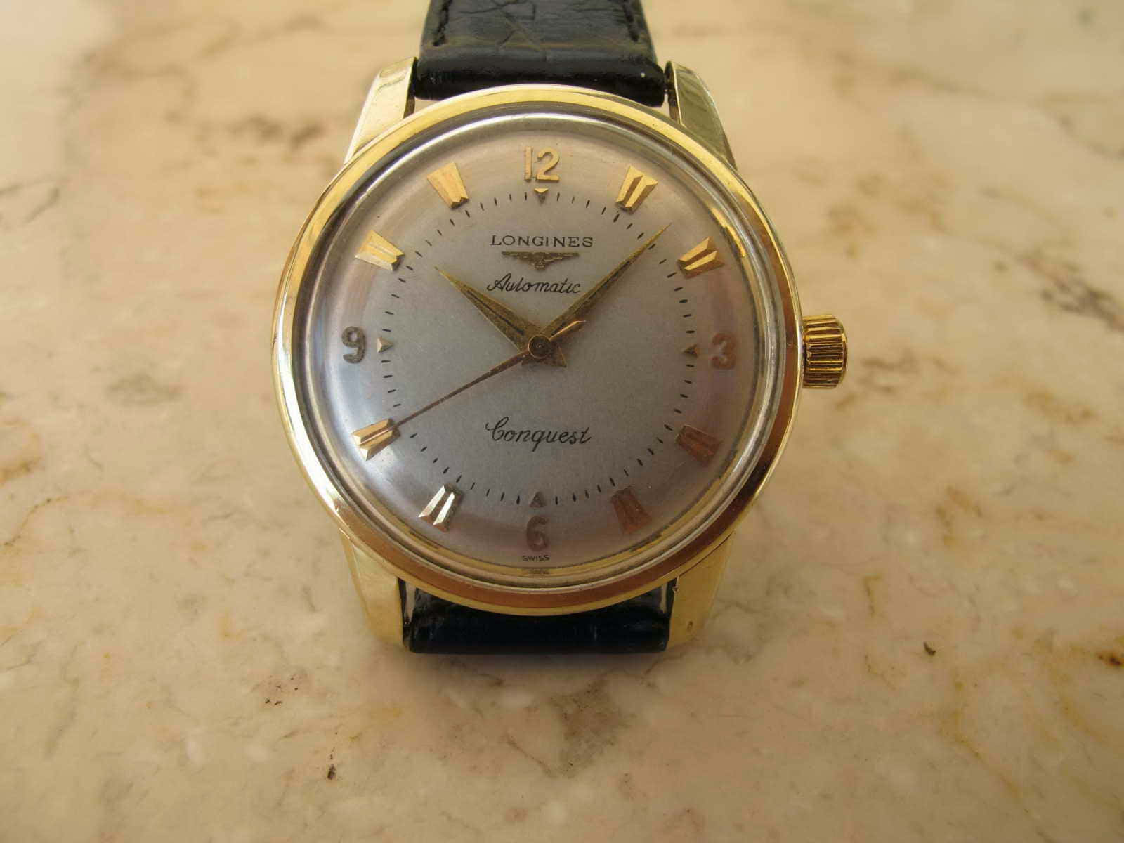 Longines Conquest Gold Top Background