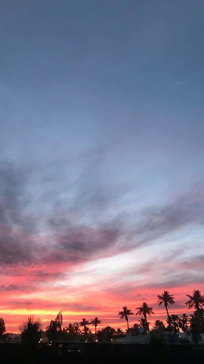 Look Up And Be Taken Away To Another World With The Beautiful Blue Sky. Background