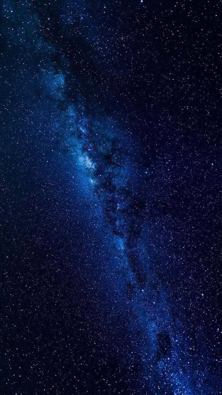 Look Up To The Starry Night Sky And Be Mesmerized By The Cool Blues Of The Galaxy Background