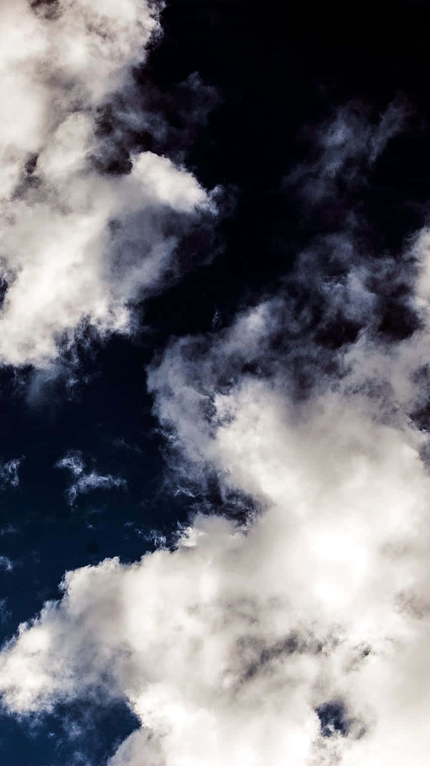 Looking Up At Dark And Brooding Clouds Background