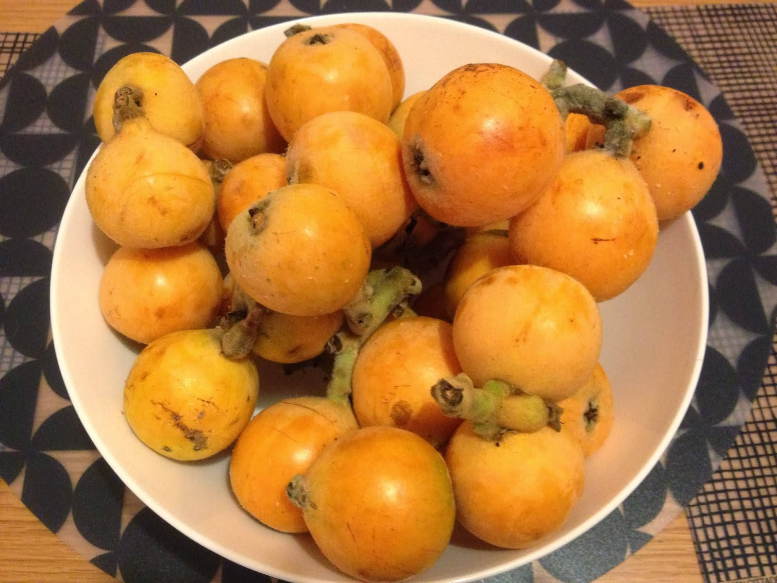 Loquat Fruits In A White Bowl Background