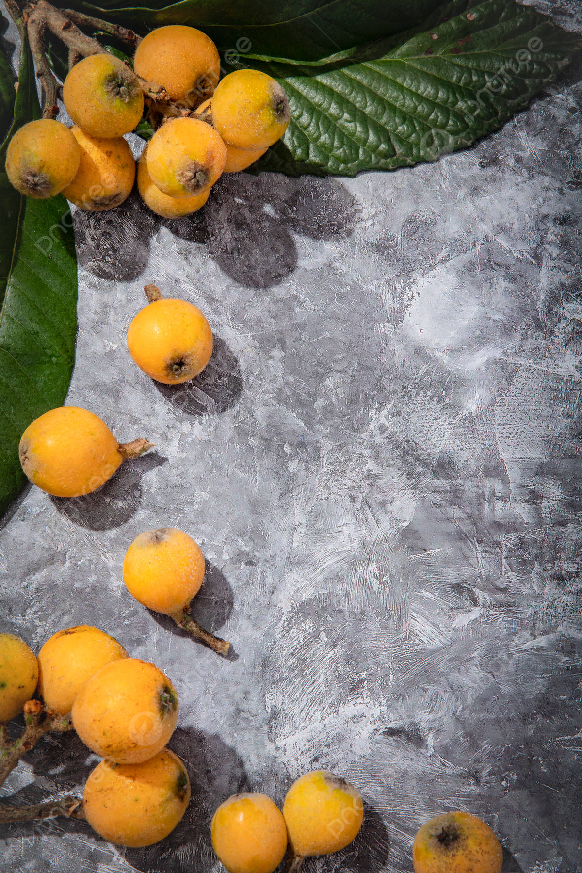 Loquat Fruits On Gray Table Background