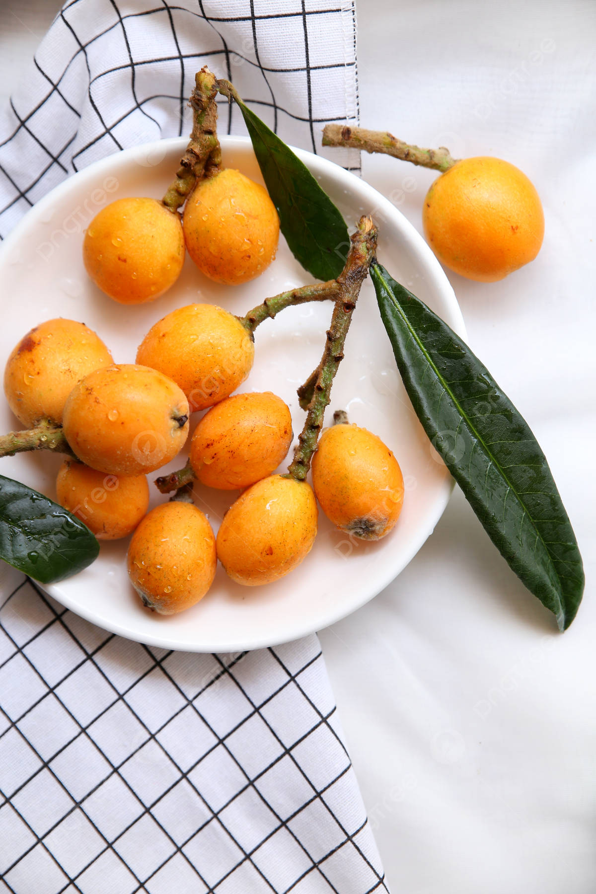 Loquat Fruits On White Plate Background