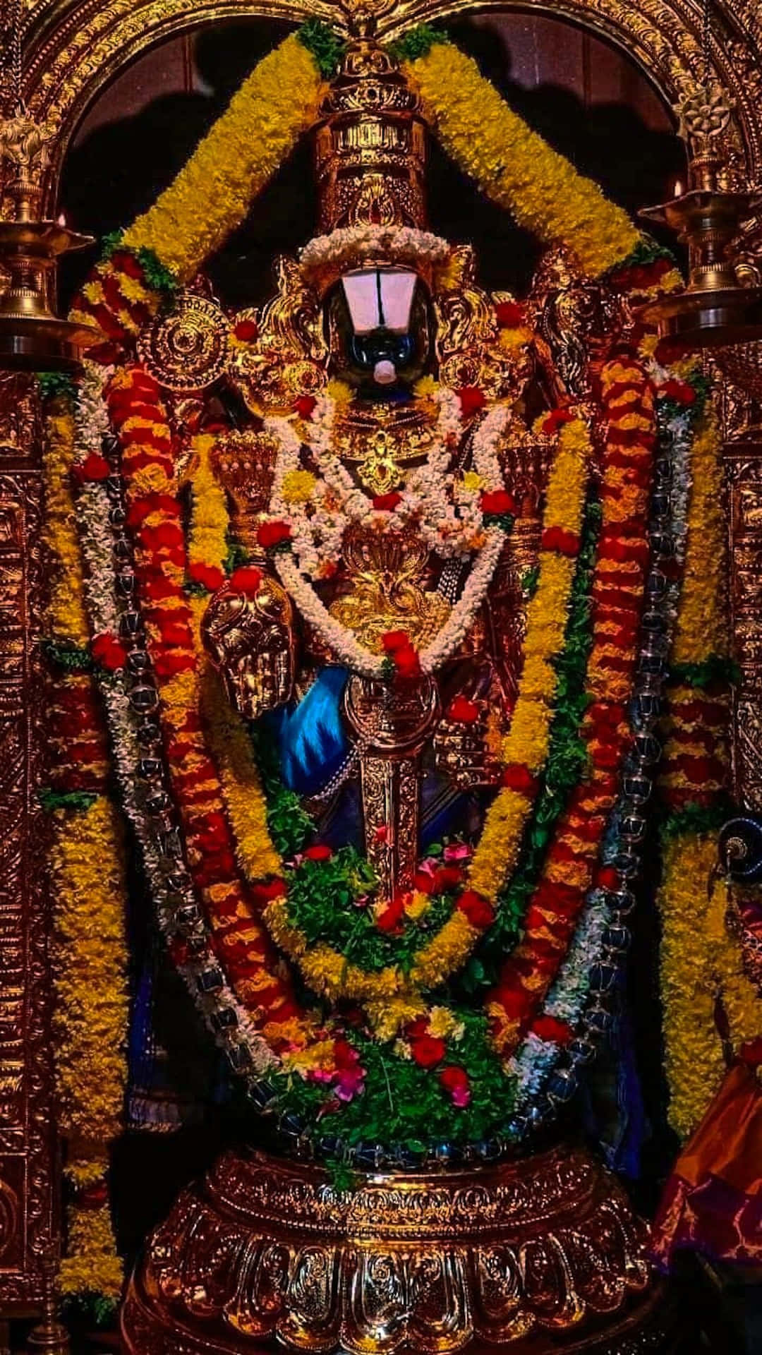 Lord Balaji Adornedin Flowersand Jewelry