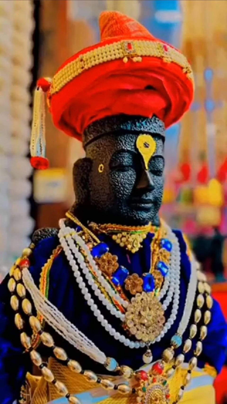 Lord Pandurang Stone Statue In Blue Garment Background