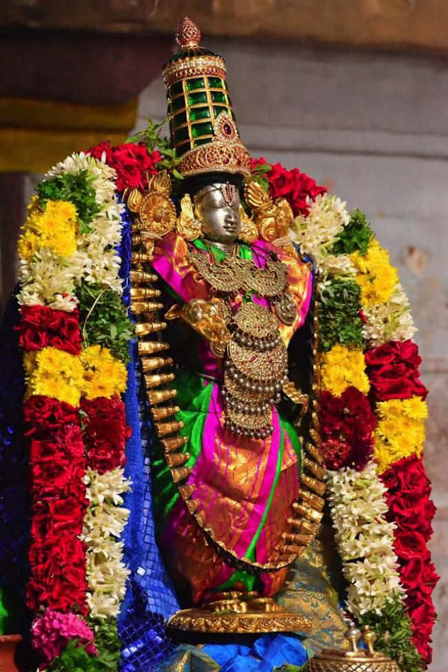 Lord_ Perumal_ Adorned_in_ Flowers_and_ Jewelry.jpg