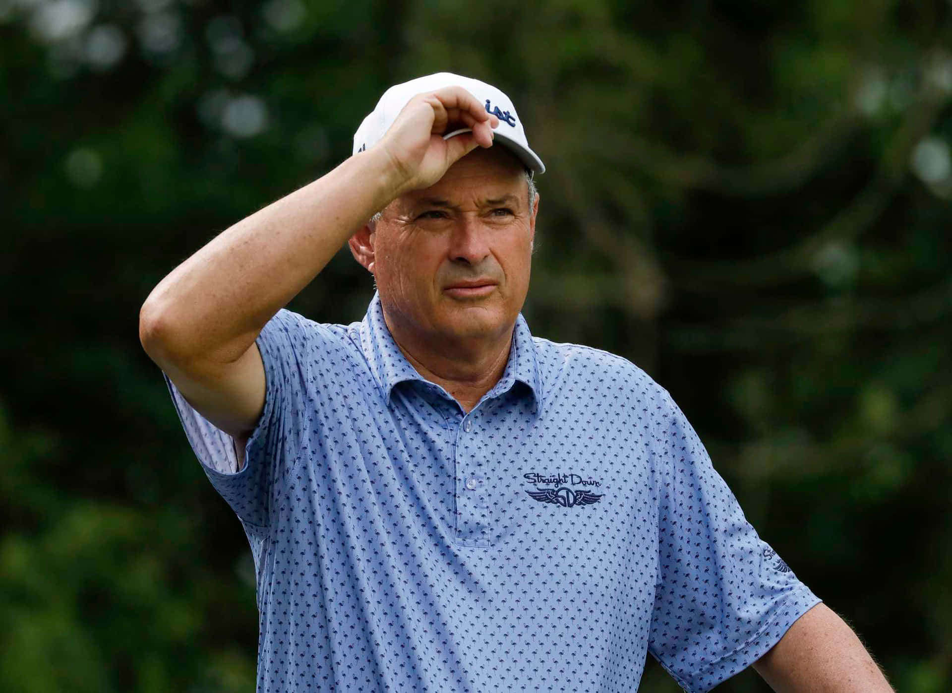 Loren Roberts Holding Golf Cap