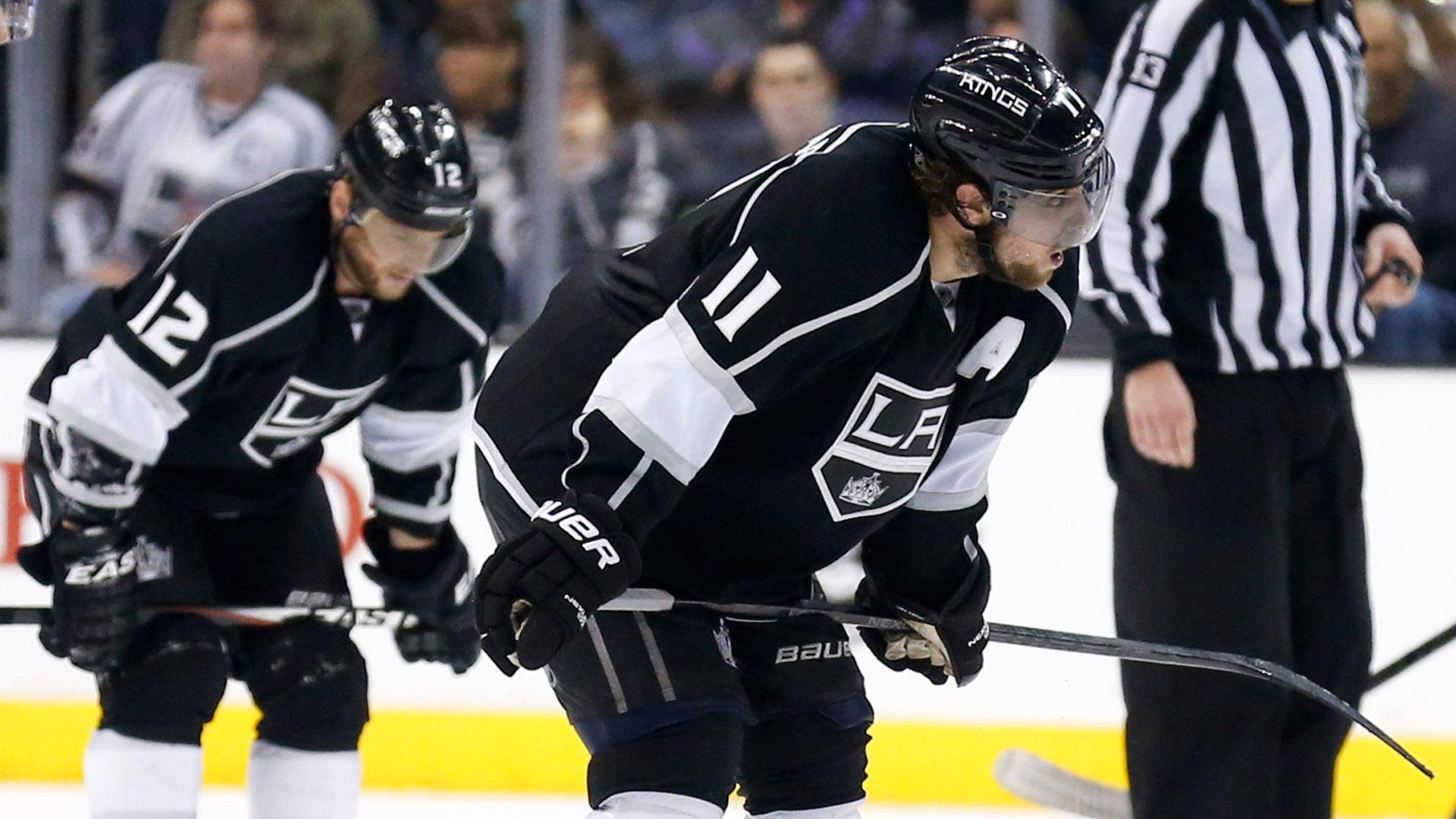 Los Angeles Kings' Players Anze Kopitar And Trevor Moore In Action Background