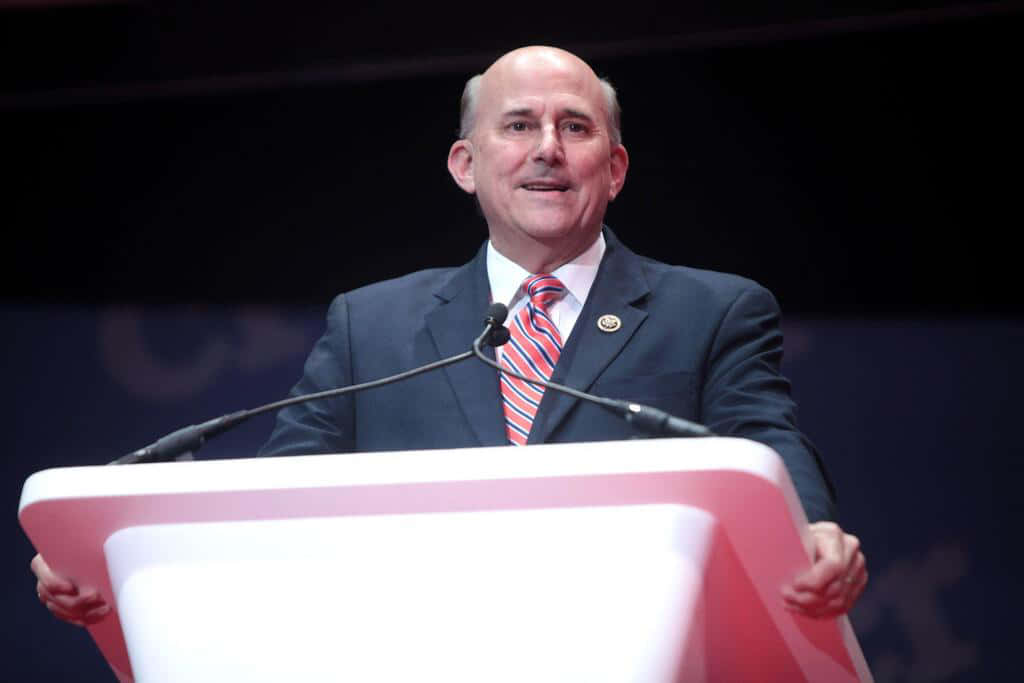 Louie Gohmert Holding Edges Of Podium