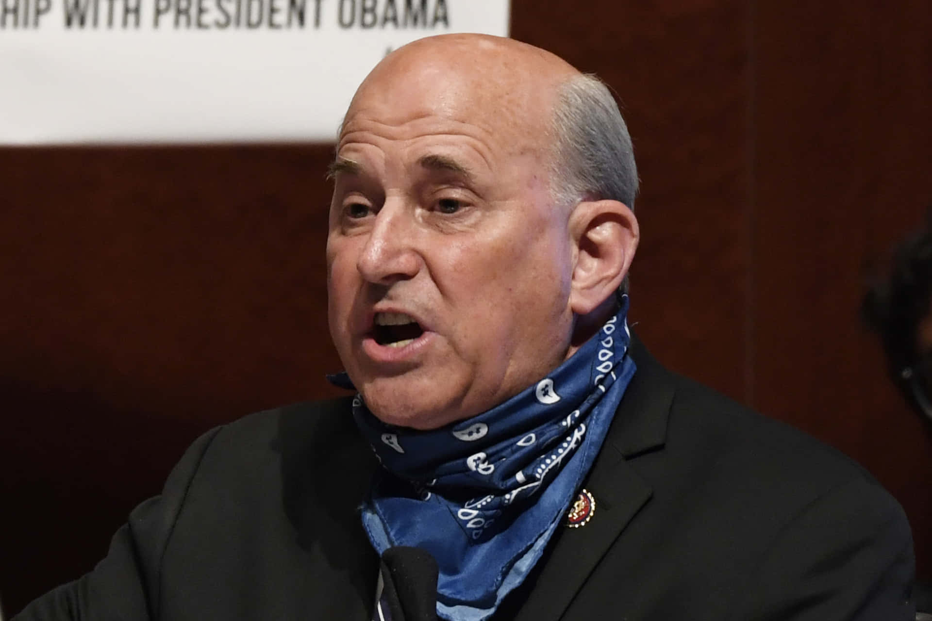 Louie Gohmert Sporting A Bandana Around His Neck Background