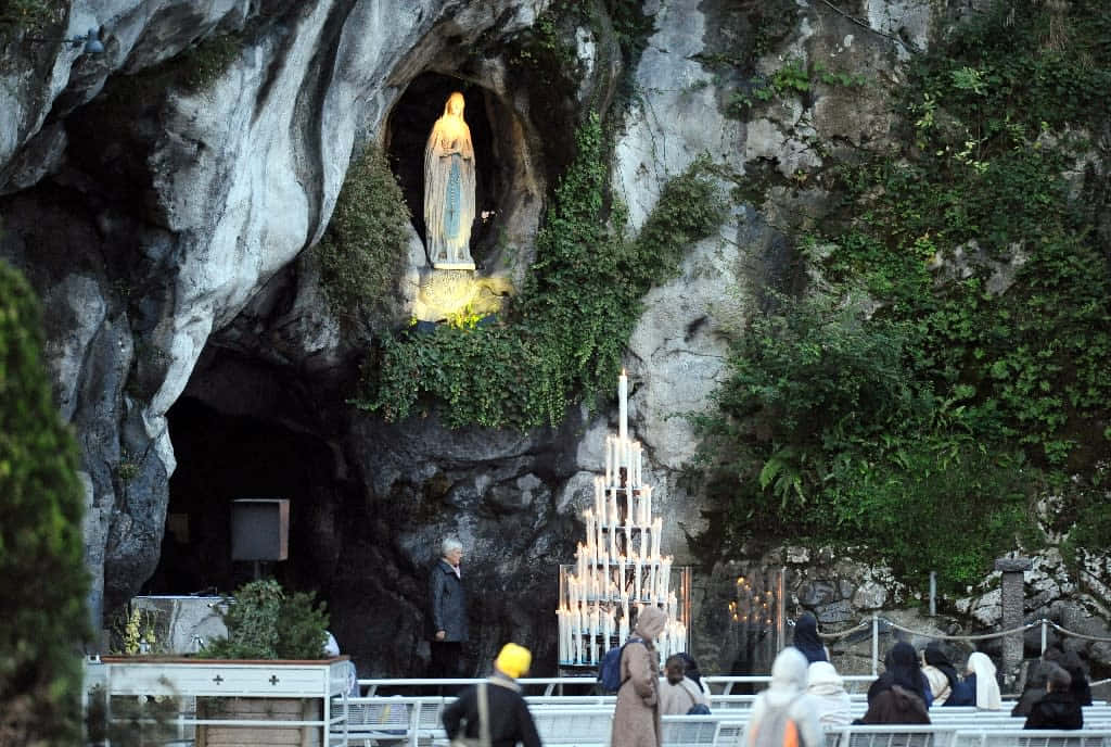 Lourdes Grottowith Virgin Mary Statue Background