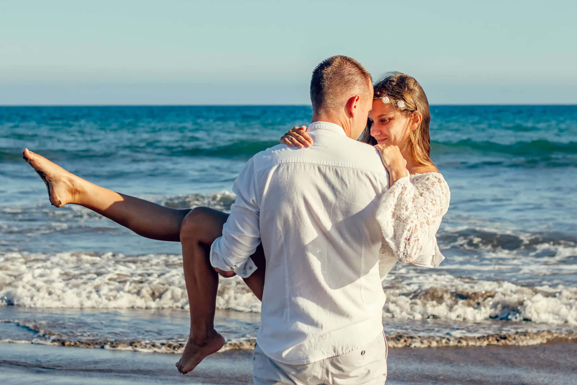 Lovers Carry Couple At Beach Background