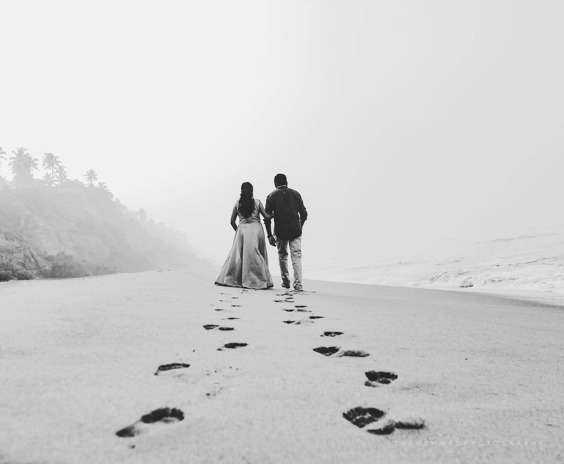 Lovers Footprints On The Sand Background