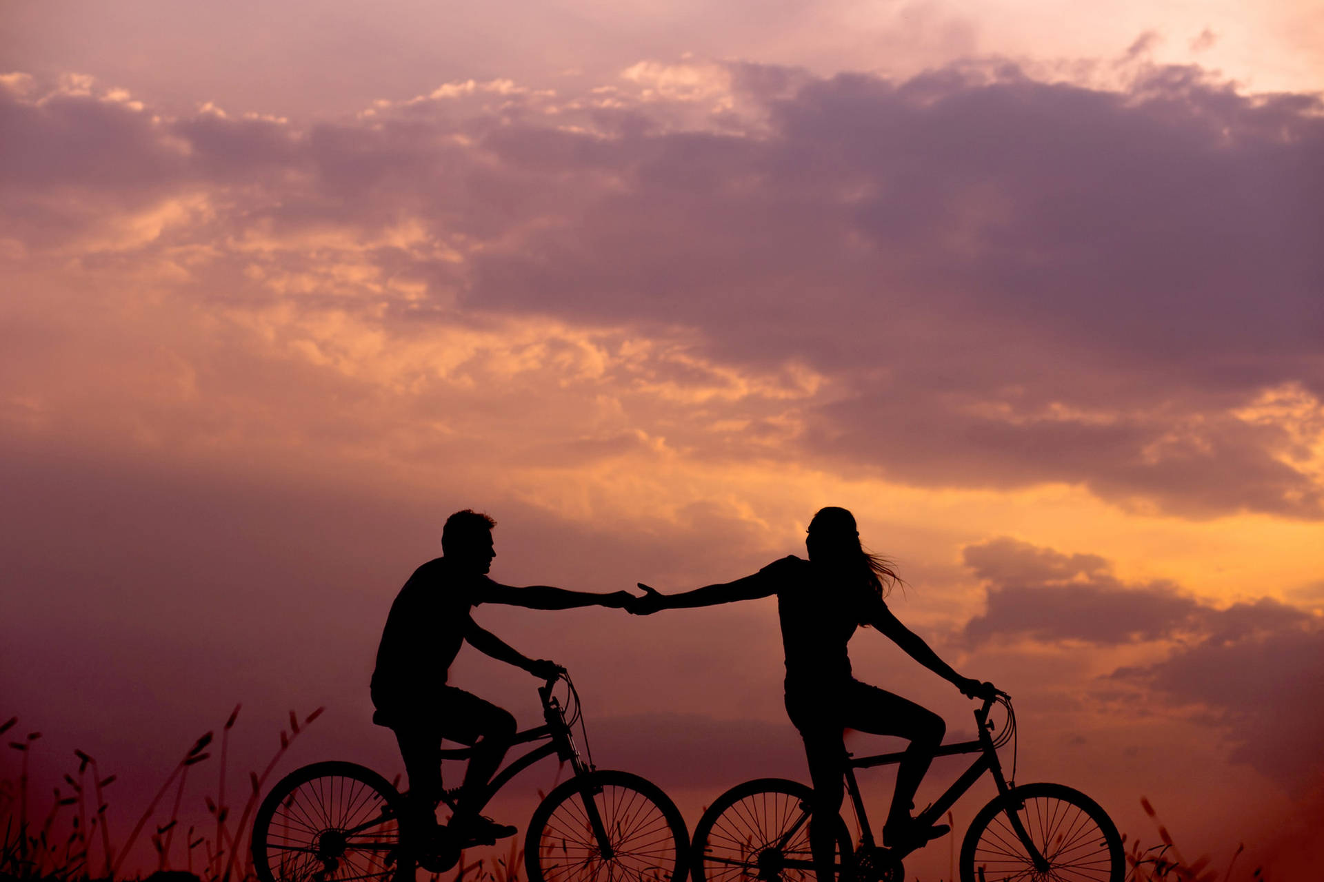 Lovers In A Bike Amidst The Sunset Profile