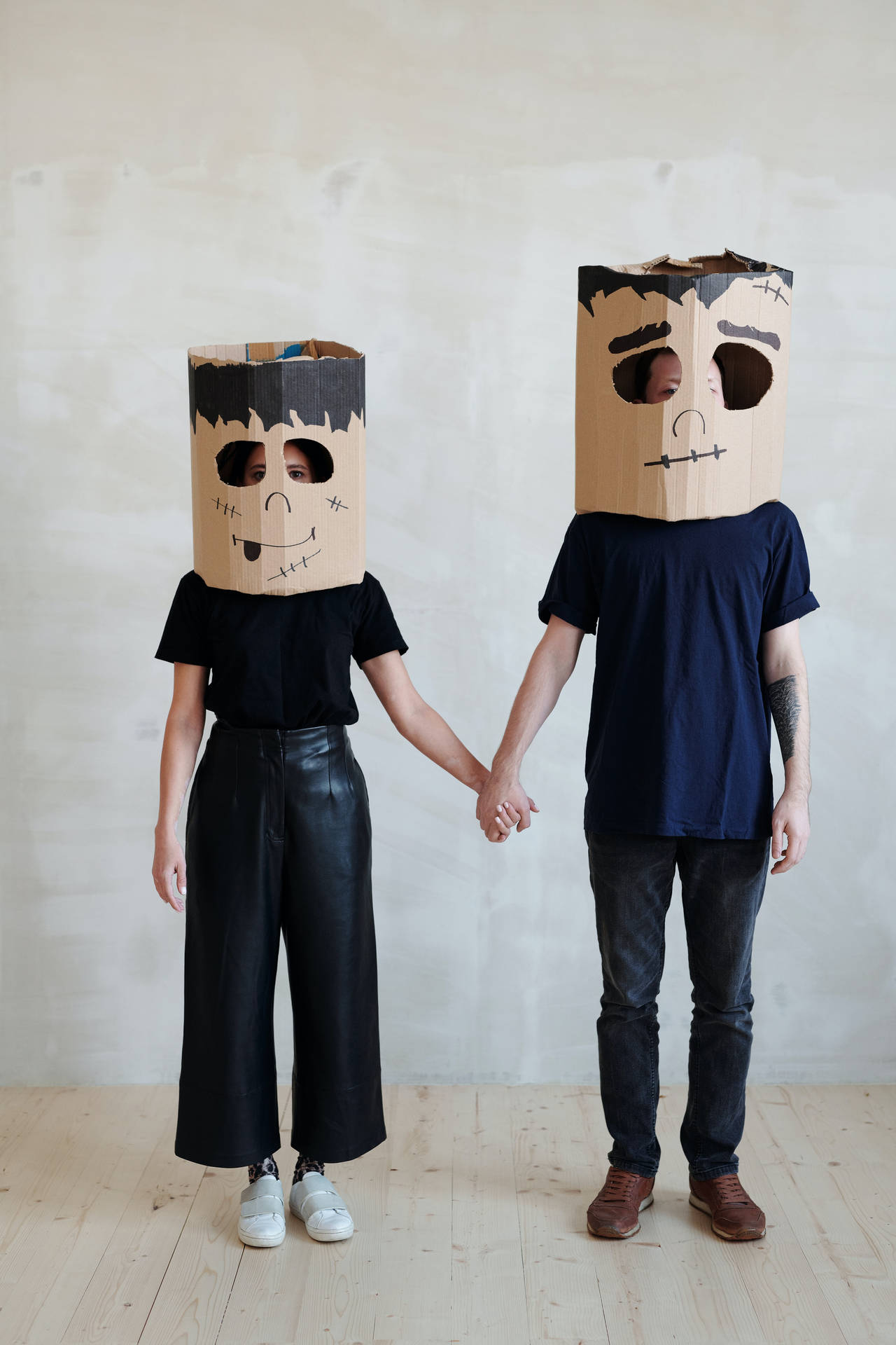 Lovers In Cardboard Masks Background