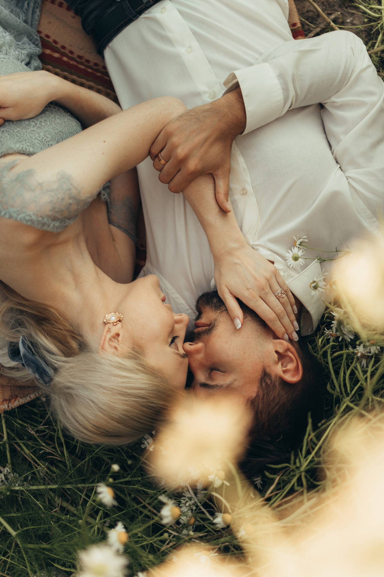 Lovers Lying On Grass Background