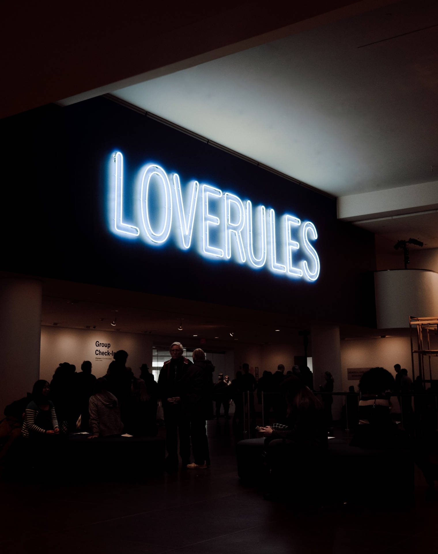 Loverules Signage In Neon Blue Iphone Background