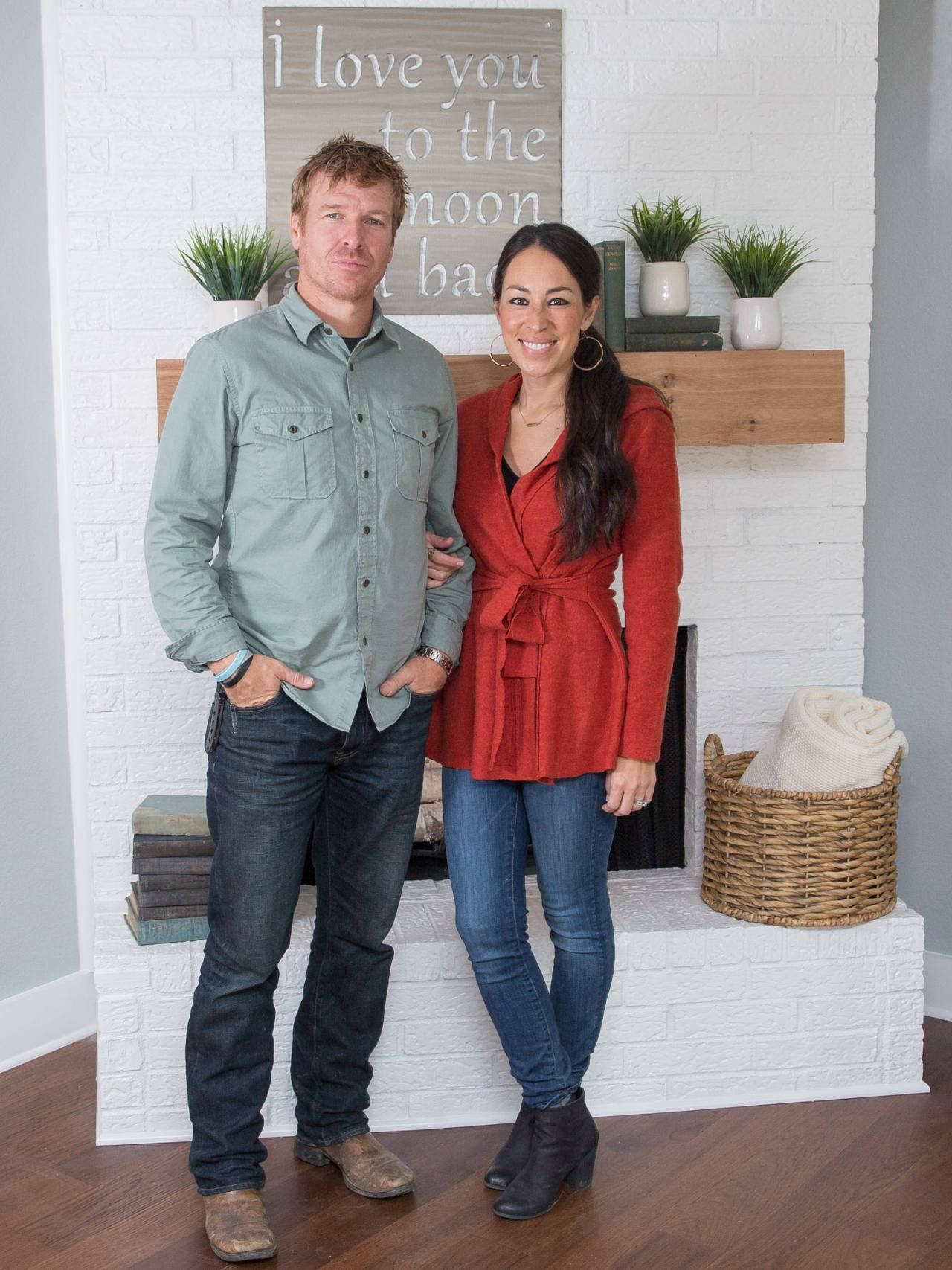 Loving Moment Captured Between Chip And Joanna Gaines Background