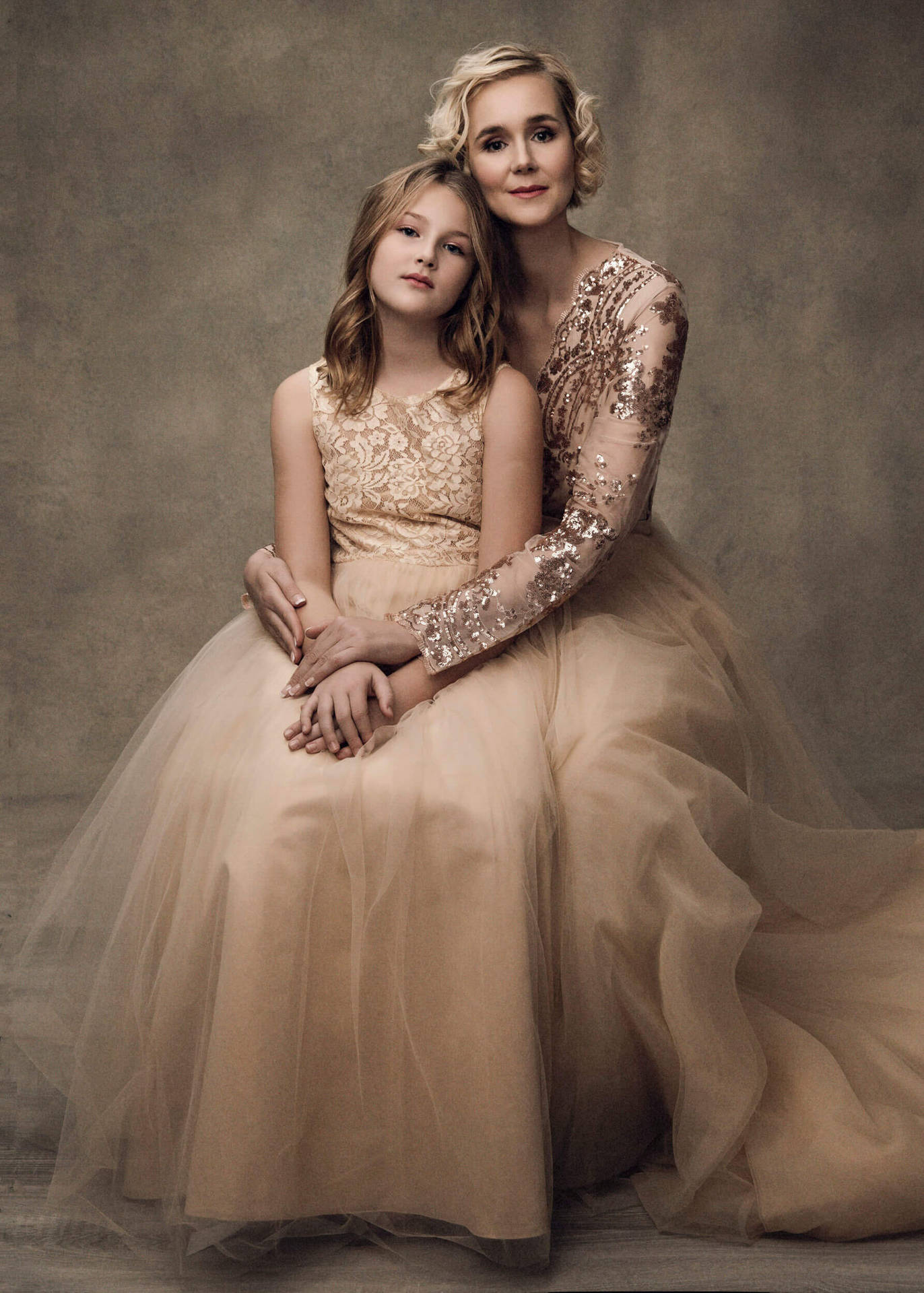 Loving Mother And Daughter In Matching Elegant Gowns