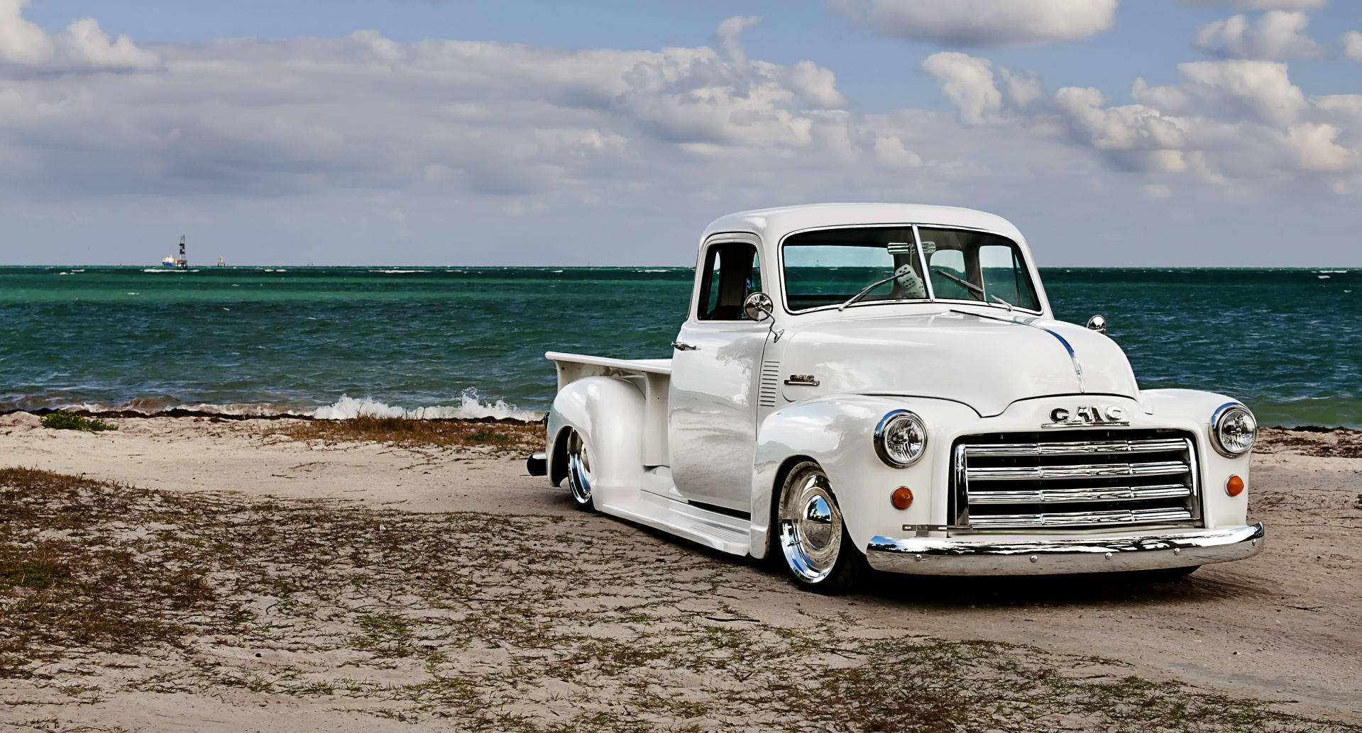 Lowrider Gmc Pickup On Beach Background