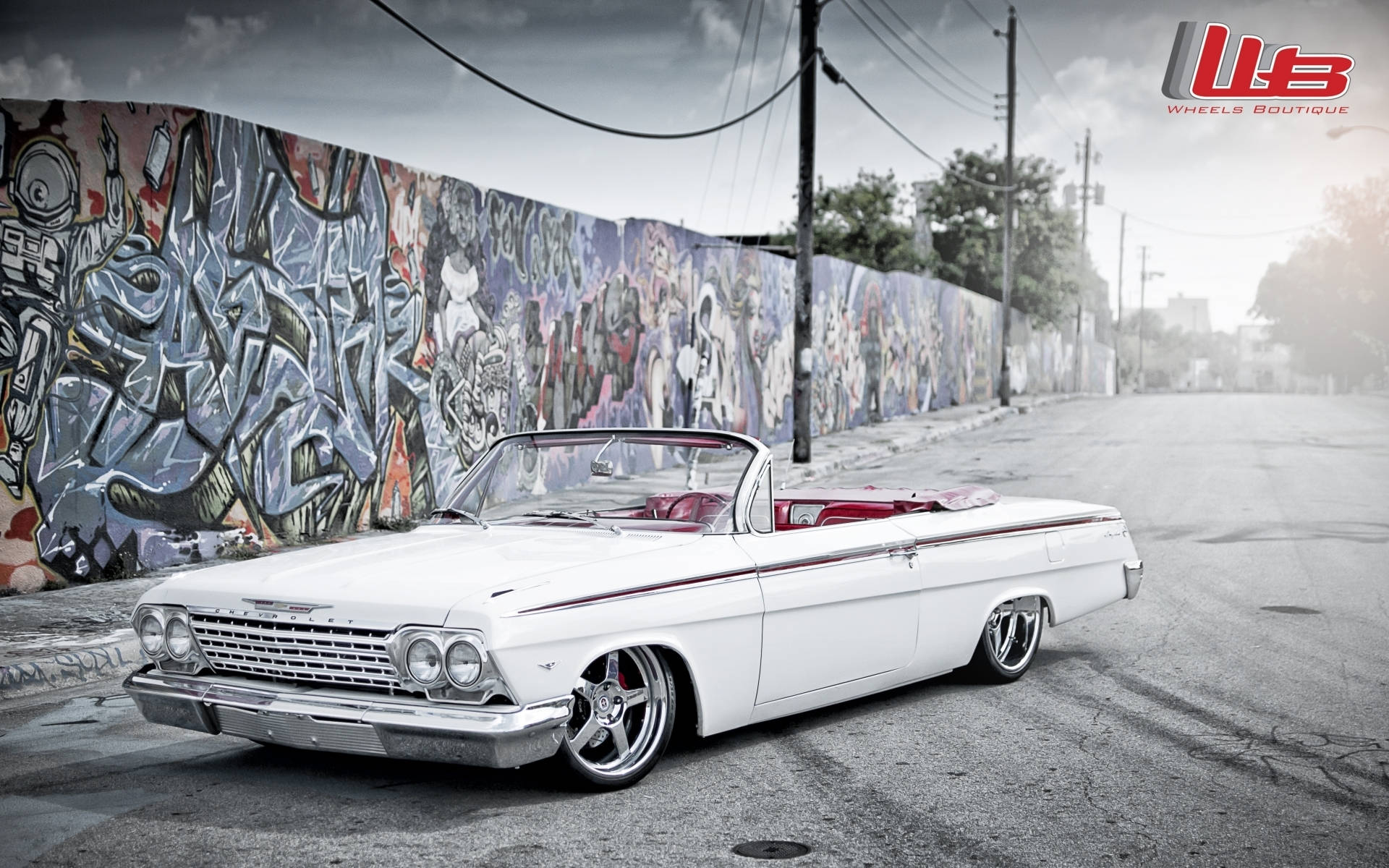 Lowrider Impala Near Graffiti Wall Background